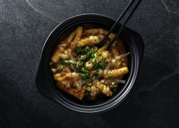 Bowl of spicy tteokbokki, a popular Korean street food you can find in Dubai