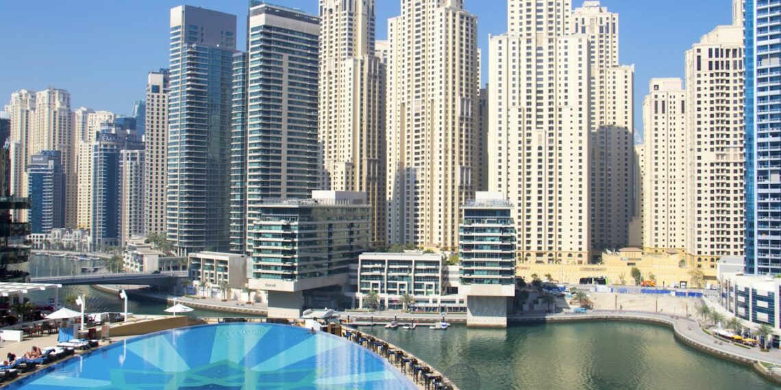Residential apartment towers and a pool in Dubai Marina, a popular area for renting an apartment in Dubai
