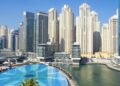 Residential apartment towers and a pool in Dubai Marina, a popular area for renting an apartment in Dubai