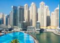 Residential apartment towers and a pool in Dubai Marina, a popular area for renting an apartment in Dubai